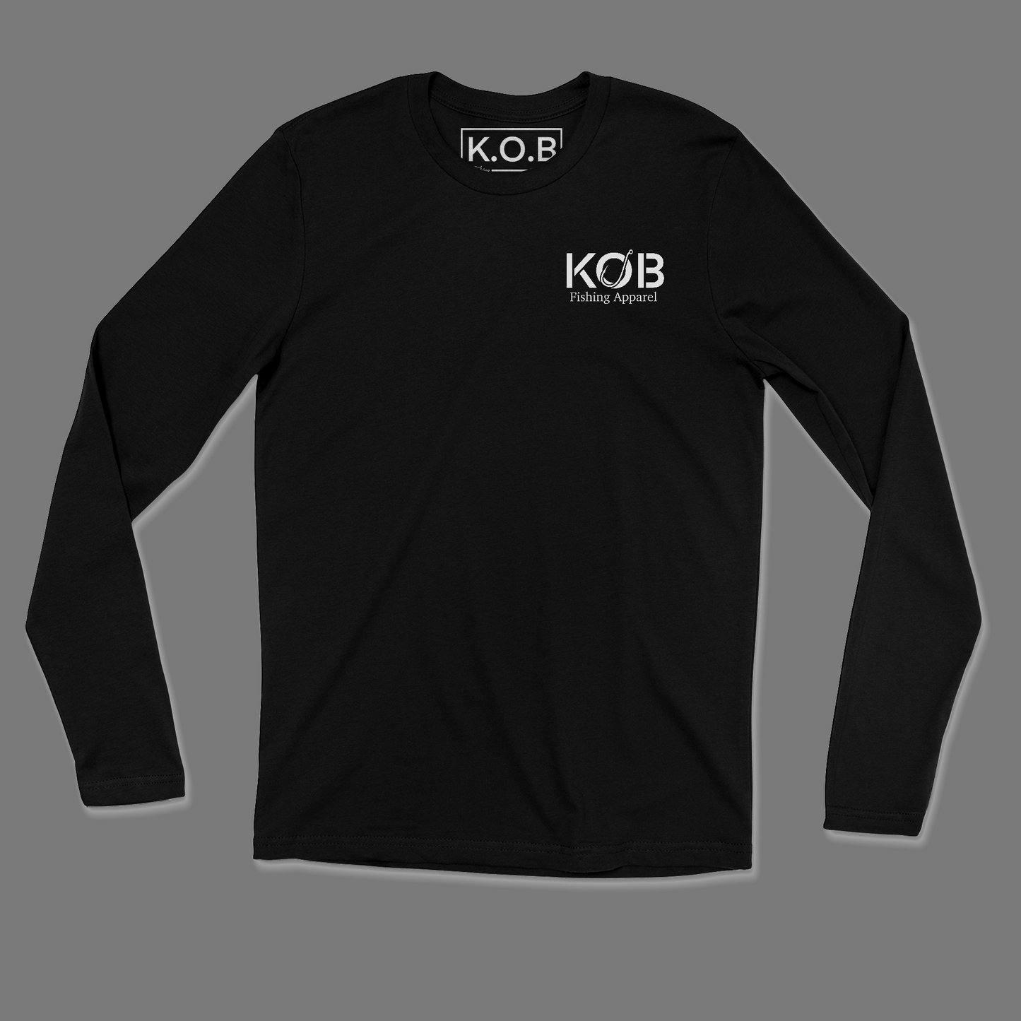 Front side of a black long sleeve shirt. On the front left chest it says KOB and on the bottom of KOB it says Fishing Apparel. Neck tag says K.O.B Fishing Apparel