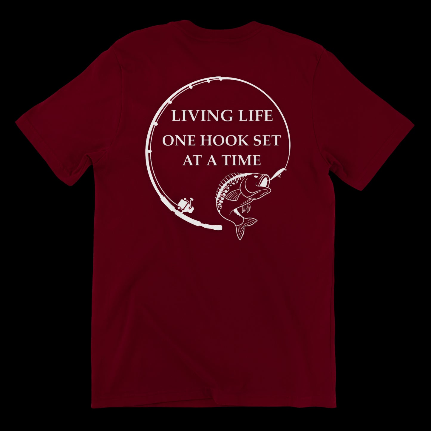 Back side of a burgundy t shirt with a fishing rod bent in a circle and a large mouth bass at the end of it. In the middle of the design it says Living life one hook set at a time in capital letters