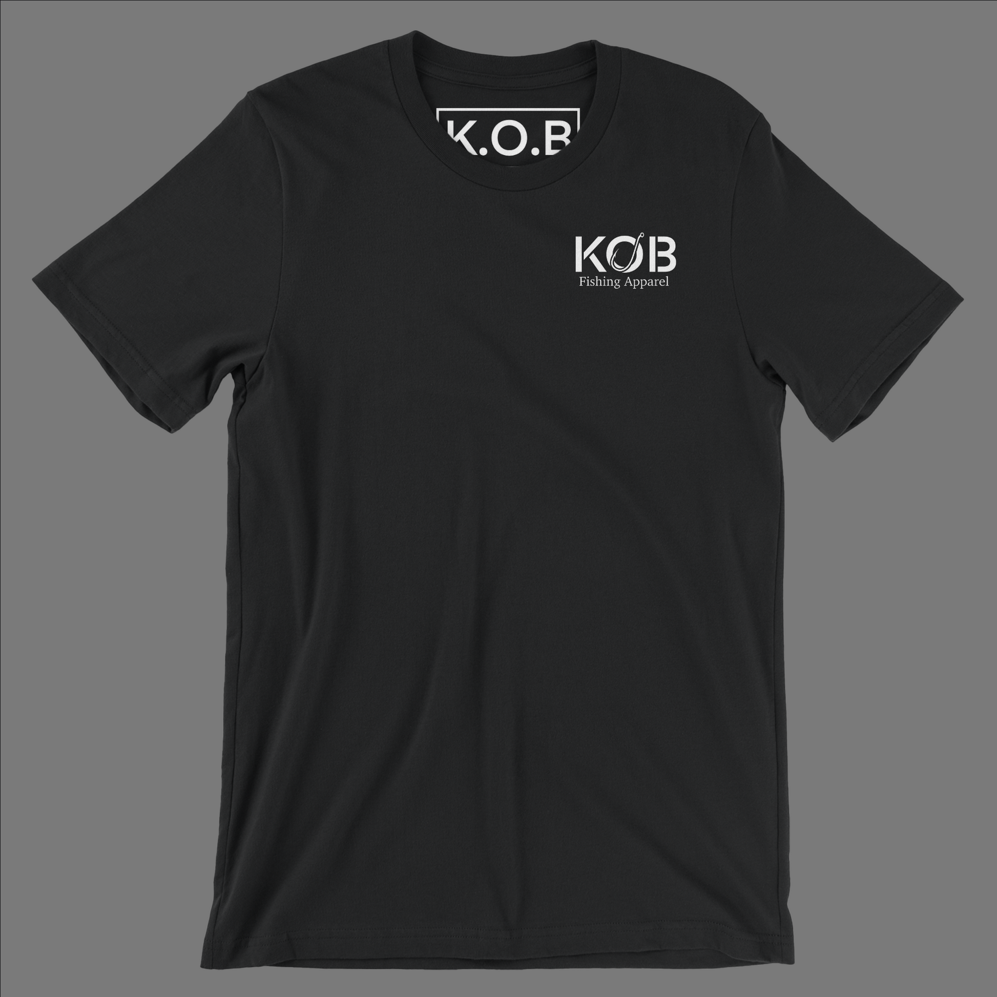 Front side of a black shirt. On the front left chest it says KOB and on the bottom of KOB it says Fishing Apparel. Neck tag says K.O.B Fishing Apparel