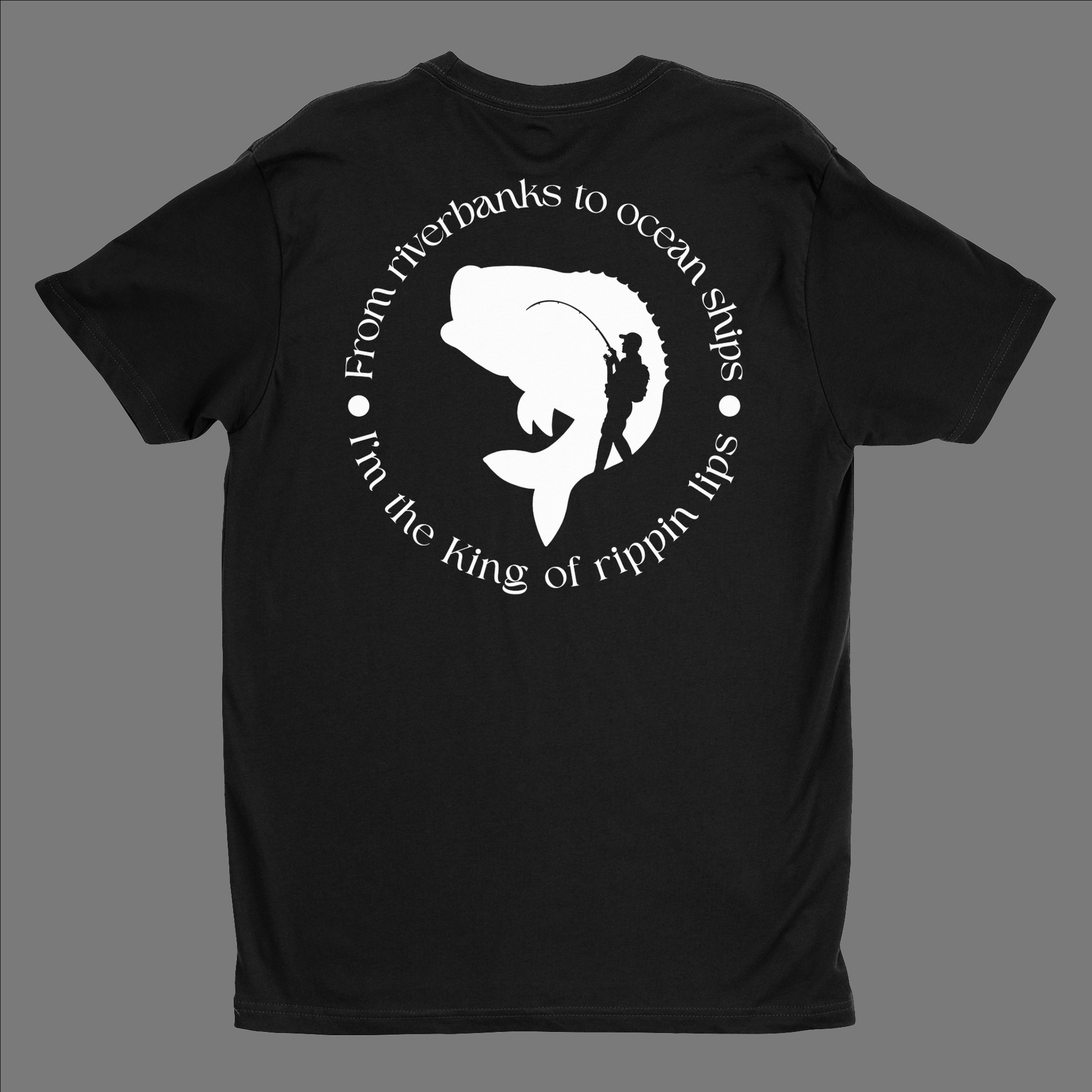 Back of a black t shirt. In a circle it says "From riverbanks to ocean ships I'm the King of Rippin lips. In the midle of the design it has a silhouette of a large mouth bass and a person holding a fishing pole with a backpack on