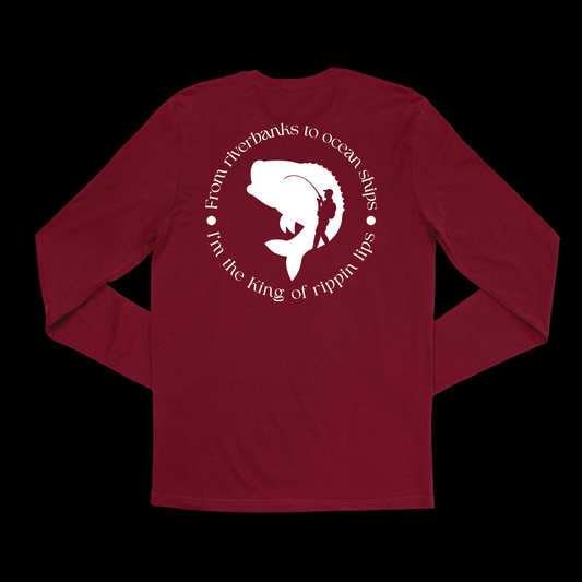 Back of a long sleeve burgundy t shirt. In a circle it says "From riverbanks to ocean ships I'm the King of Rippin lips. In the middle of the design it has a silhouette of a large mouth bass and a person holding a fishing pole with a backpack on